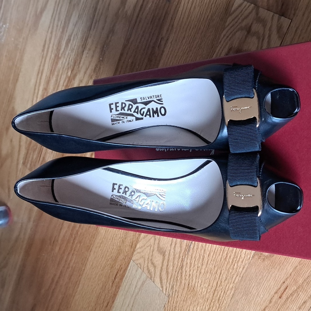 SALE- Ferragamo black leather mini platform pumps with classic gold bow.
